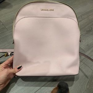 Pink backpack featuring cute dogs in photos